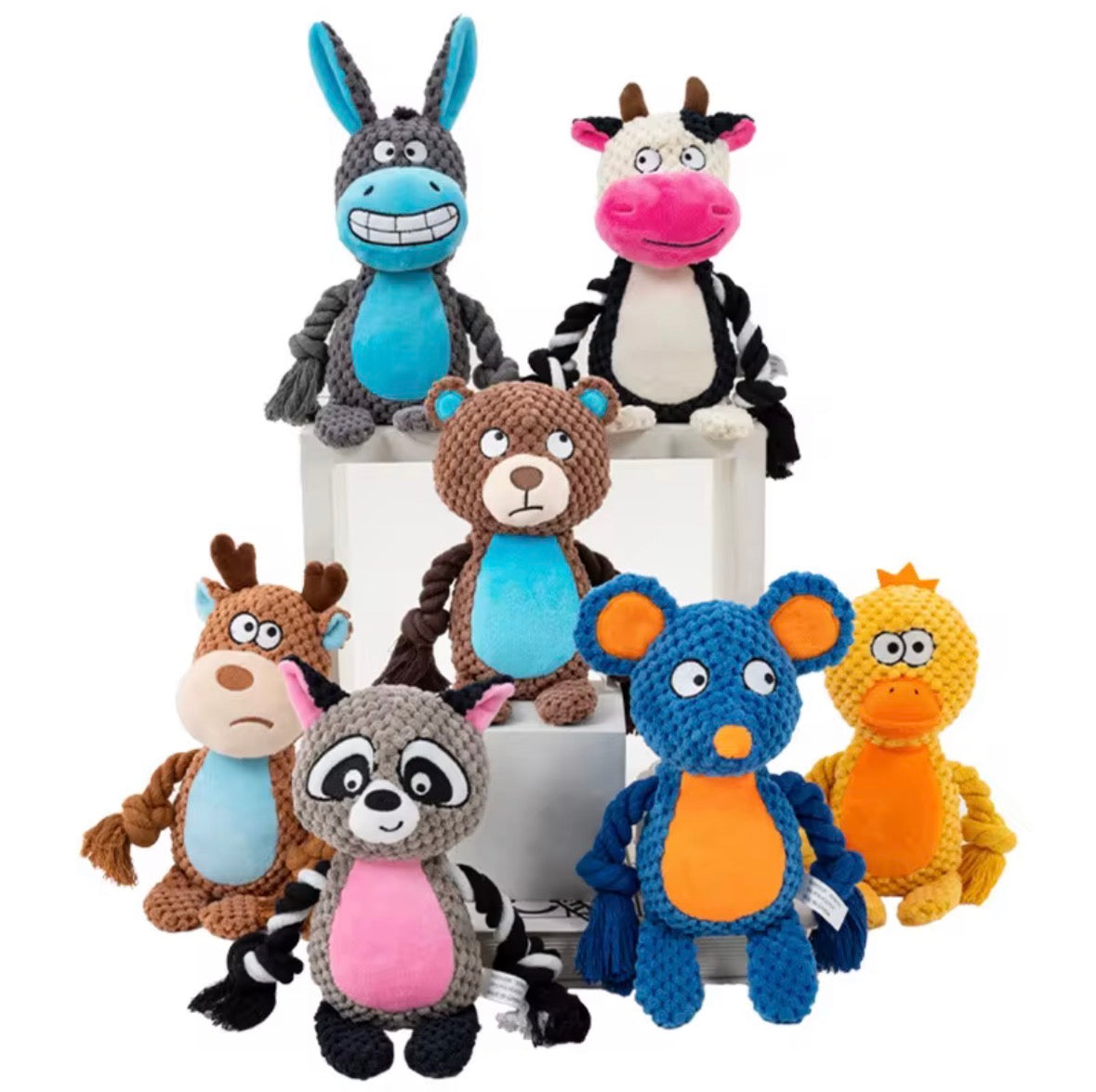 variety of squeaky plush toys shaped like cartoon animals, commonly used for interactive play with dogs